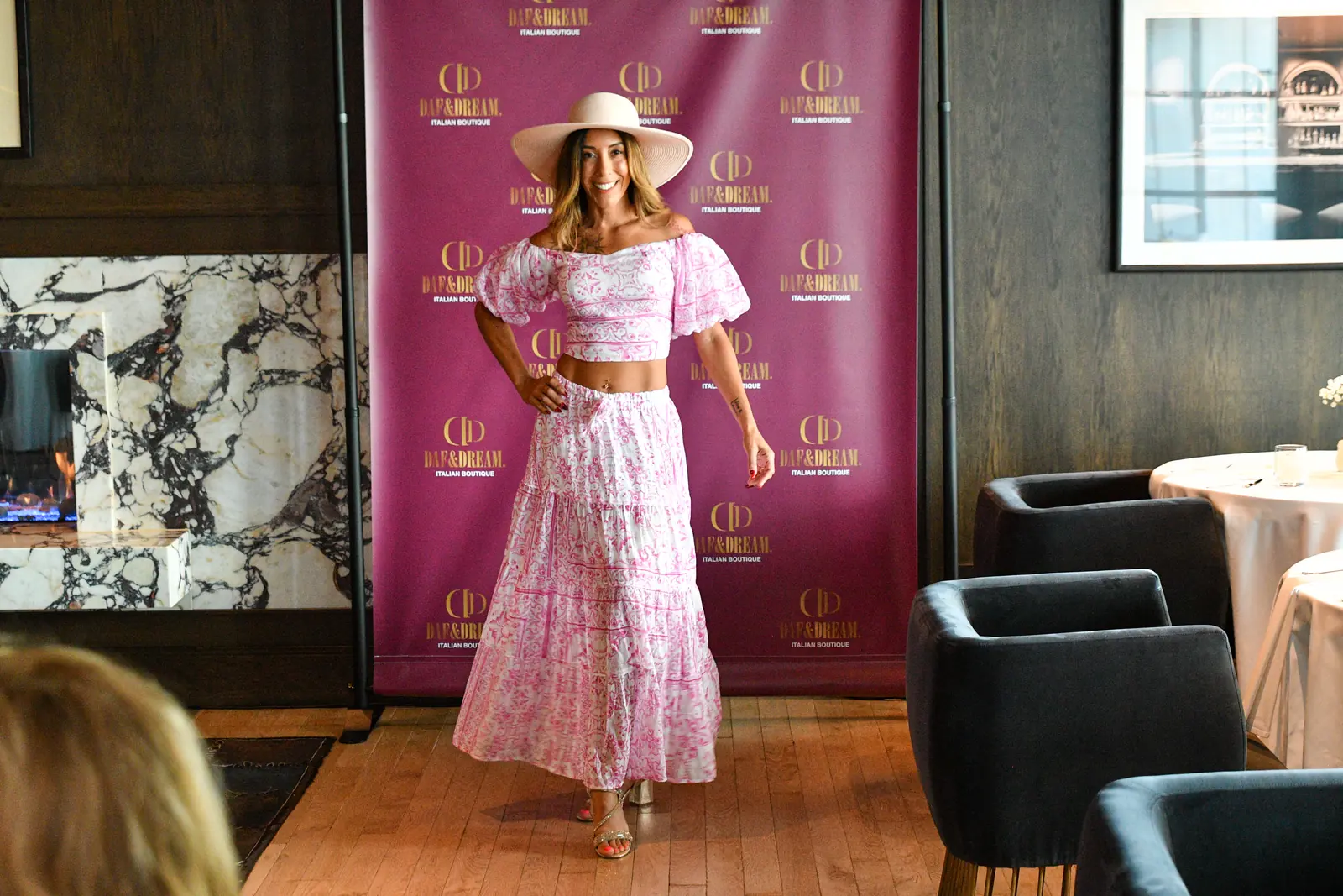 Model in a pink dress during a fashion presentation