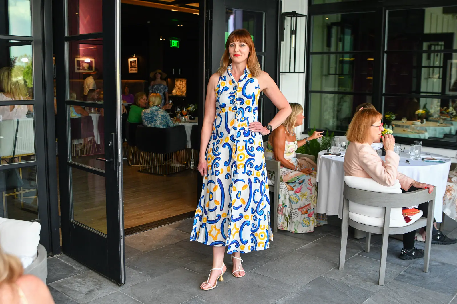 Model wearing a blue floral dress