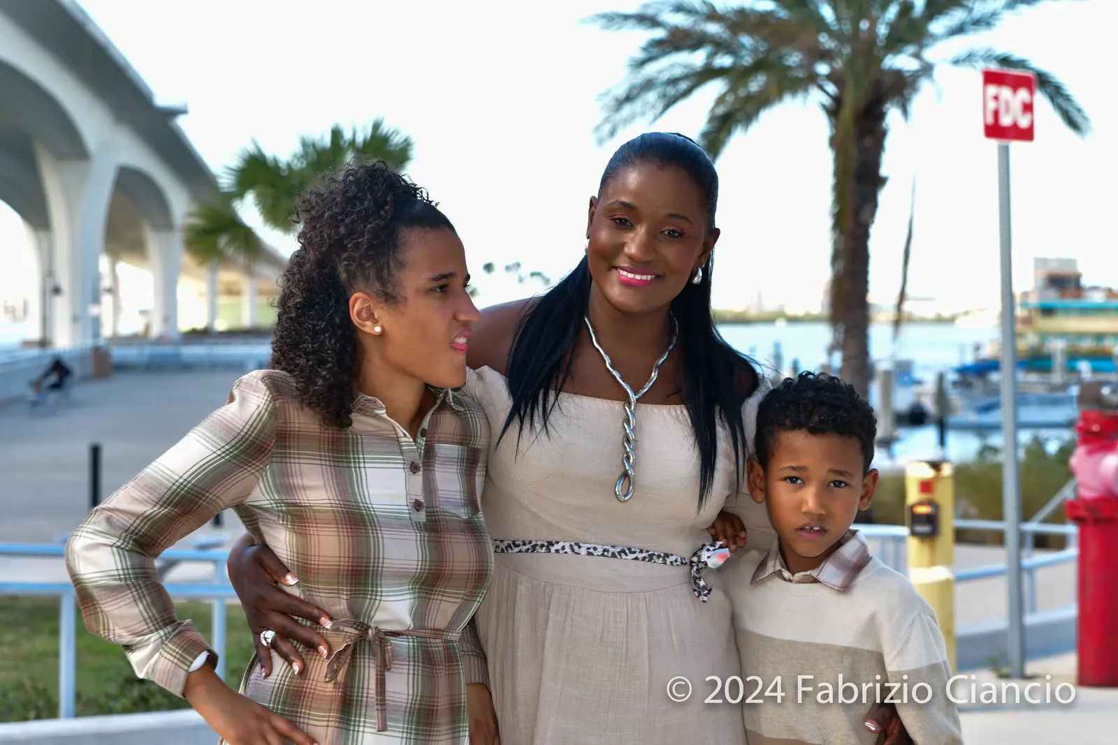 Family portrait beneath waterfront architecture