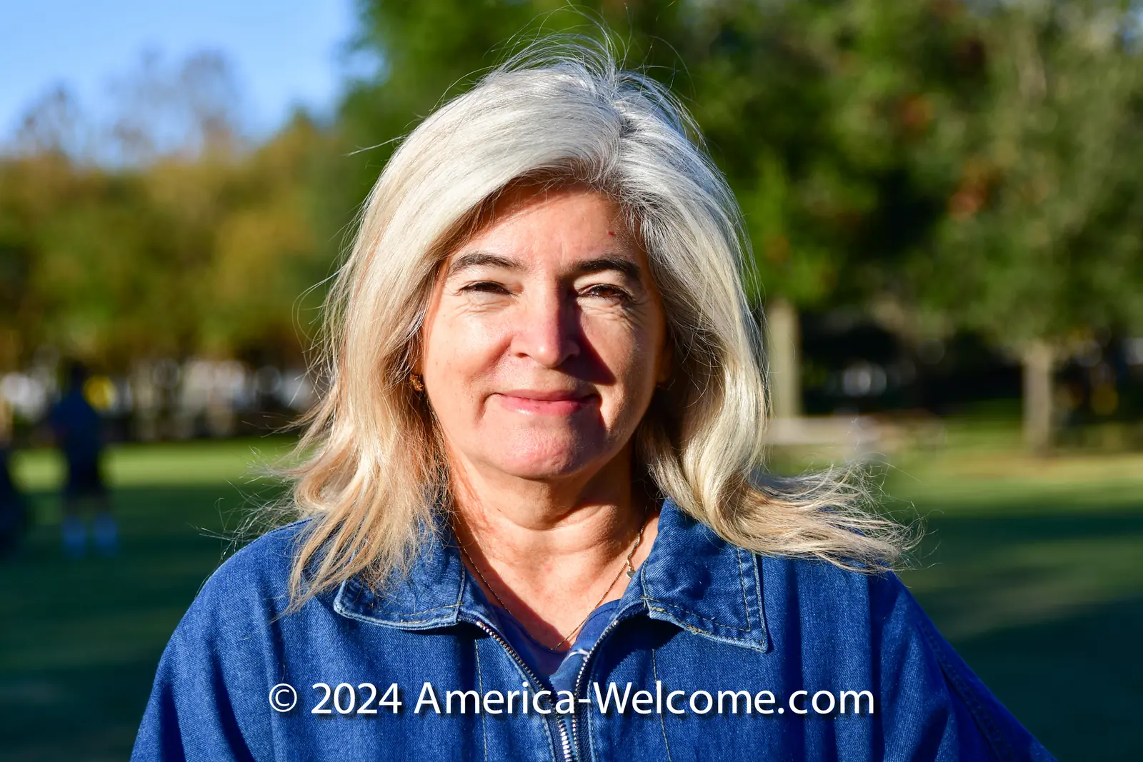 Natural-light headshot surrounded by greenery
