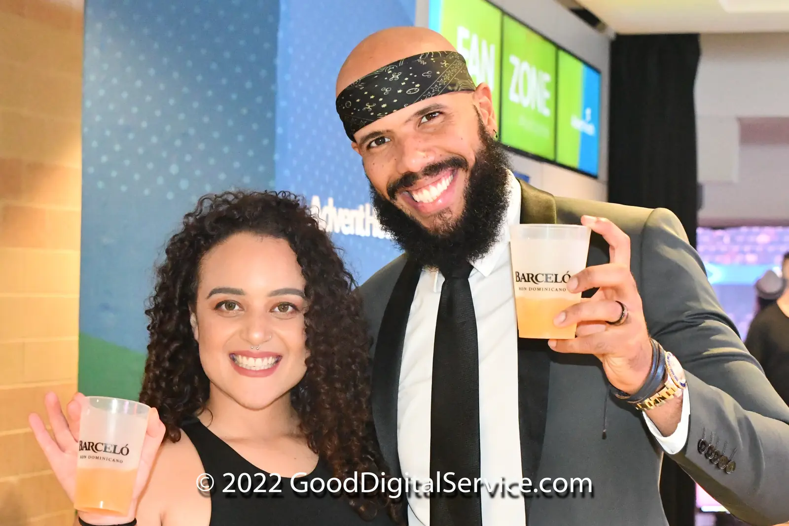 Two guests smiling at a celebration