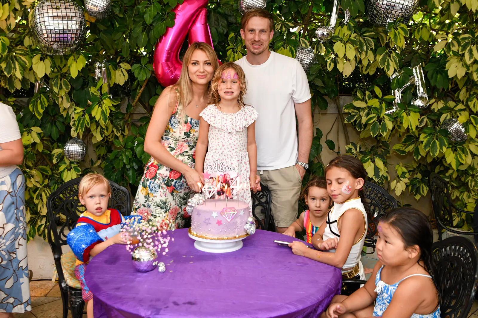 Family gathered in a tropical garden